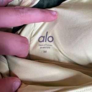 Medium highlight yellow Alo yoga bra very soft very cute and long form fitting.